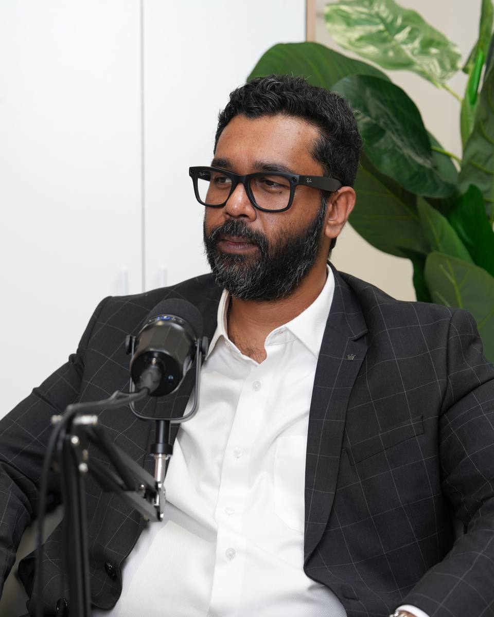 Jawaad Hussain, founder of Jawaad Trading Academy, at the mic